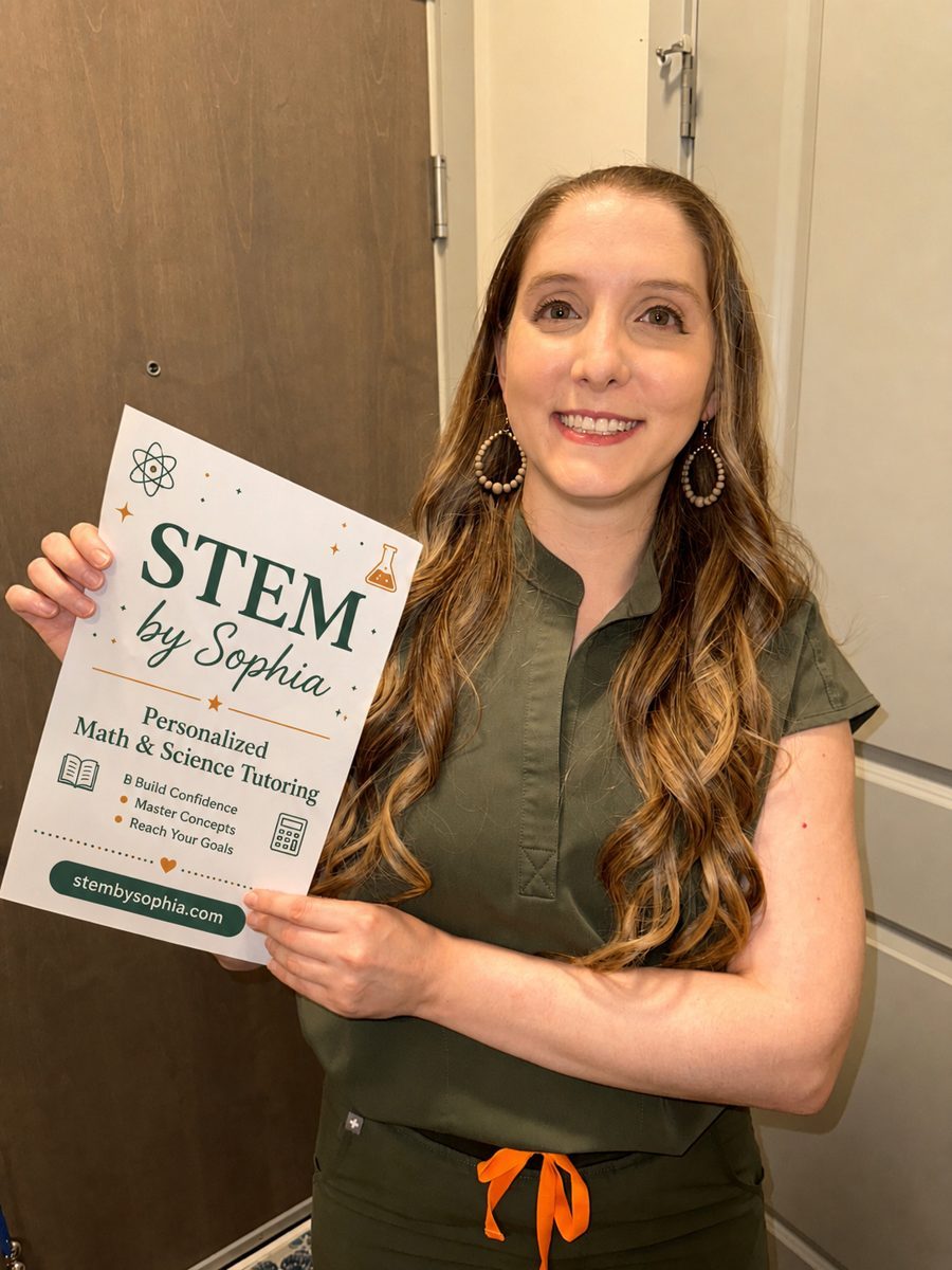 Sophia holding a STEM by Sophia sign